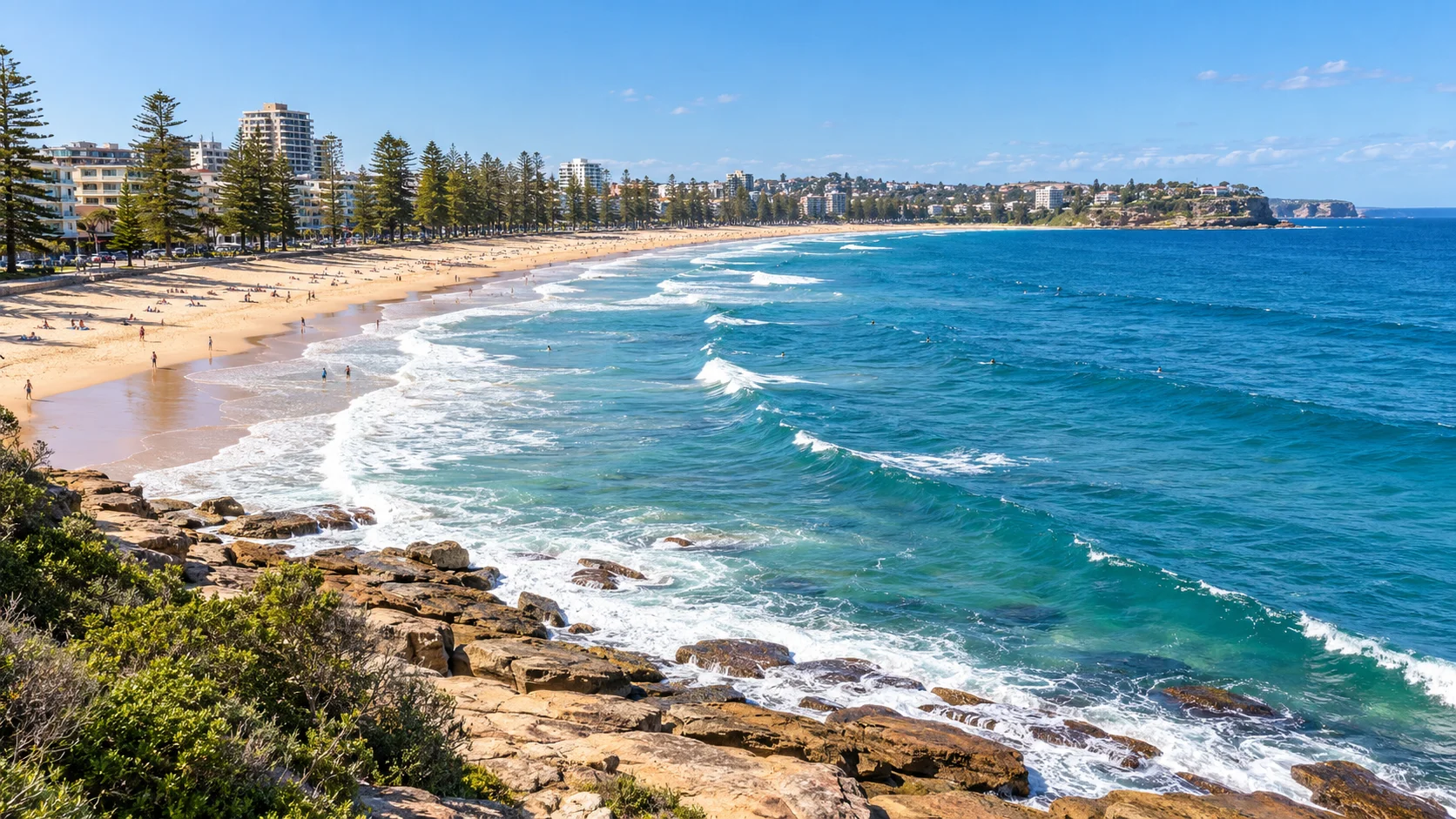 Illustrative panorama of Manly Beach, its pine-lined promenade and Pacific surf